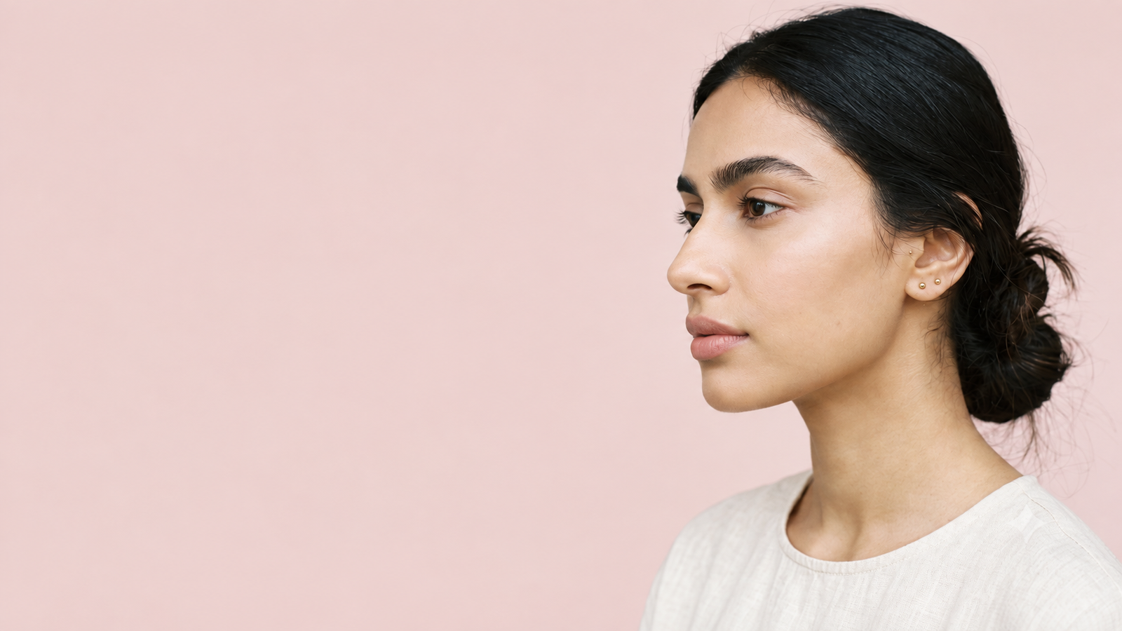 Close-up of natural brows and soft rose lips